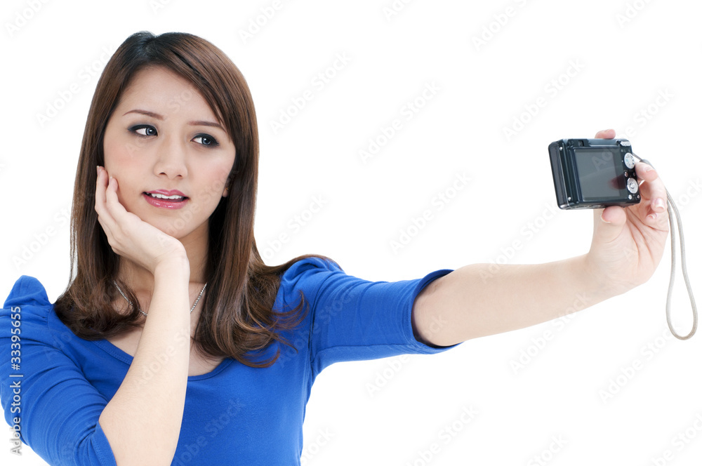 Beautiful young woman taking self portrait Beautiful young woman taking self portrait