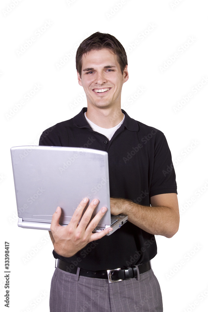 Young man standing and working on laptop Young man standing and working on laptop