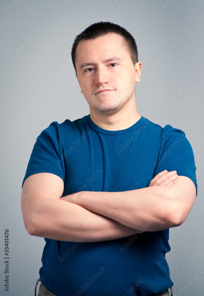 Portrait of an adult man standing with a confident face Portrait of an adult man standing with a confident face