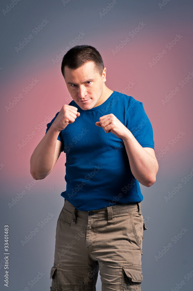 young man standing in a boxing position young man standing in a boxing position