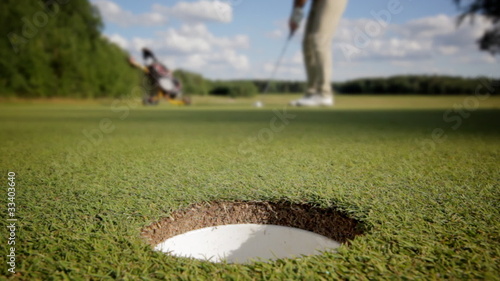 Ball rolling into the hole