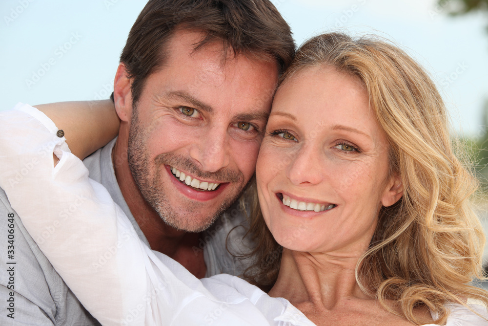 Couple stood with arms around each other Couple stood with arms around each other