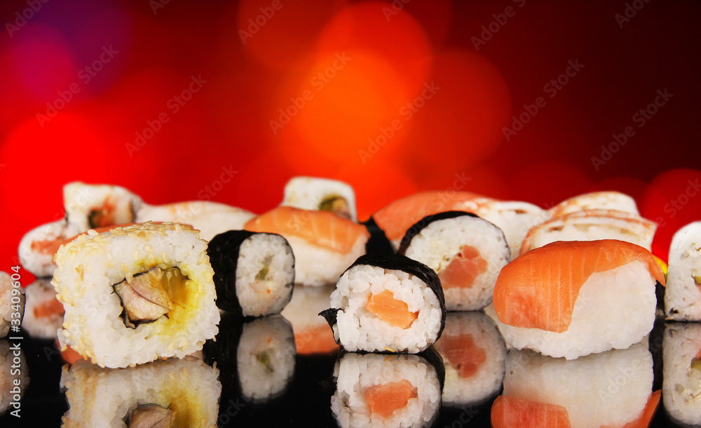 Delicious sushi on shiny blur background Delicious sushi on shiny blur background