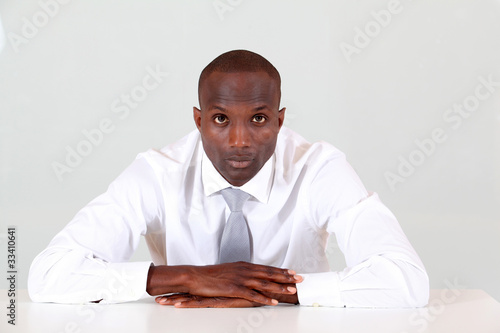 Portrait of businessman sitting at his desk