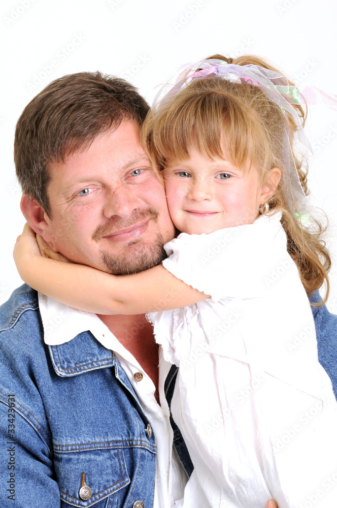 young father in jeans and toddler girl hugging and smiling young father in jeans and toddler girl hugging and smiling