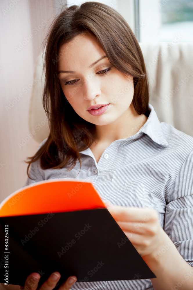 Young sexy woman at home reading book Young sexy woman at home reading book