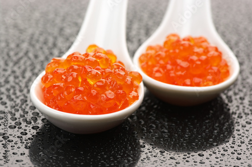 Salmon caviar in spoons
