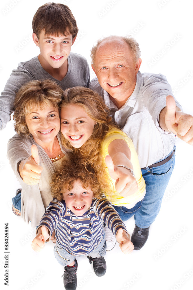 Thumbs-up family posing in style