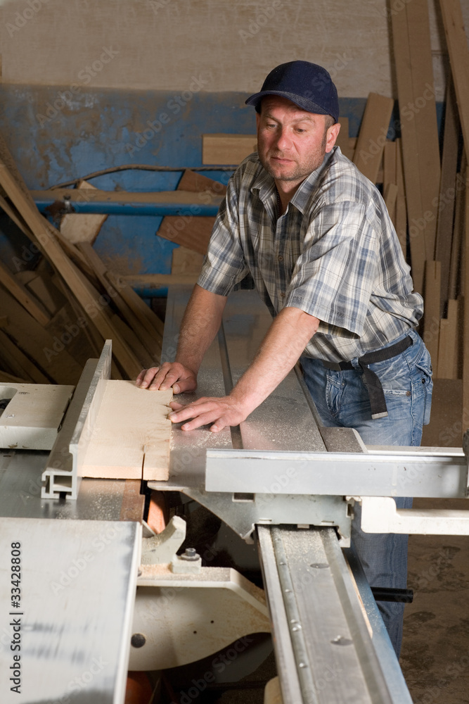 Carpenter working on woodworking machines Carpenter working on woodworking machines