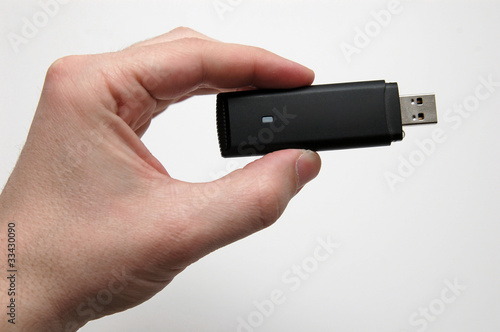 Hand with a HSPA dongle