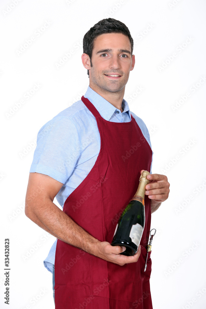 Waiter offering bottle of champagne Waiter offering bottle of champagne