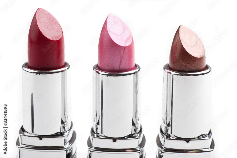 Drei Lippenstifte in einer Reihe Drei Lippenstifte in einer Reihe