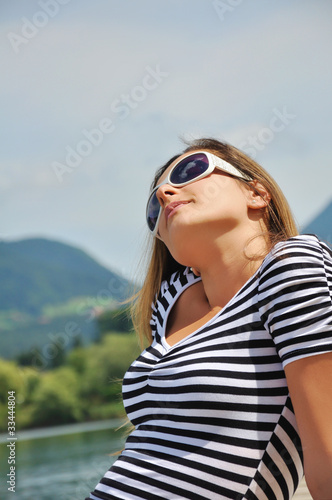 Attractive woman portrait on the lake