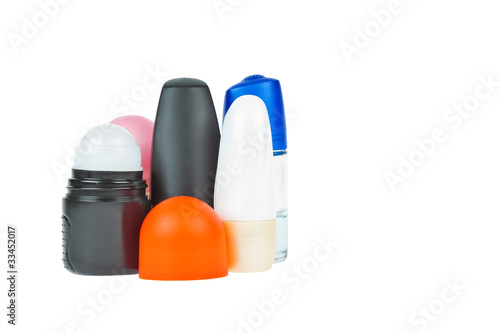 Colorful deodorant on white background photo