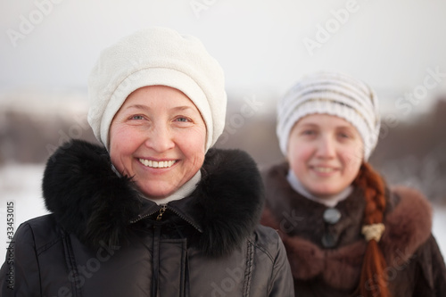 happy women in winter park photo