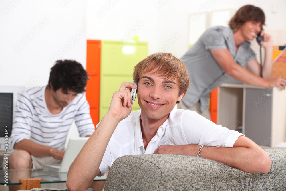 Obraz premium Three smiling lads communicating in different ways