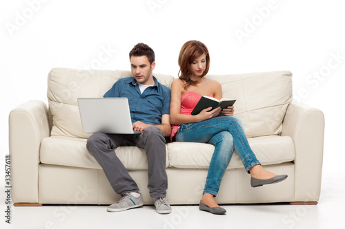 couple sitting comfortably in couch