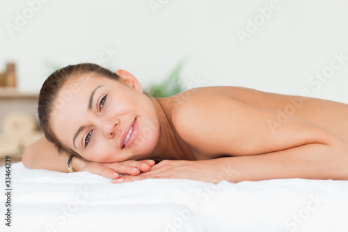 Woman lying on her belly looking at the camera