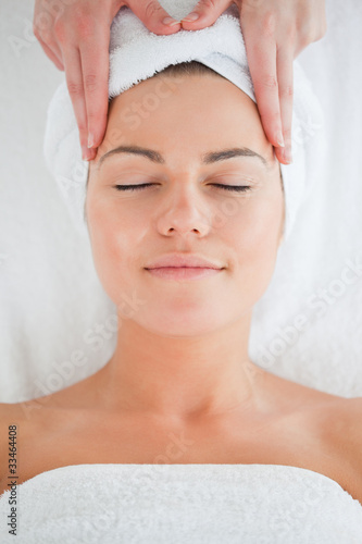Portrait of a cute woman having a facial massage
