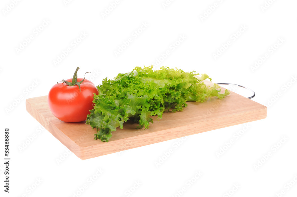 salad and tomato on cutting board isolated on white