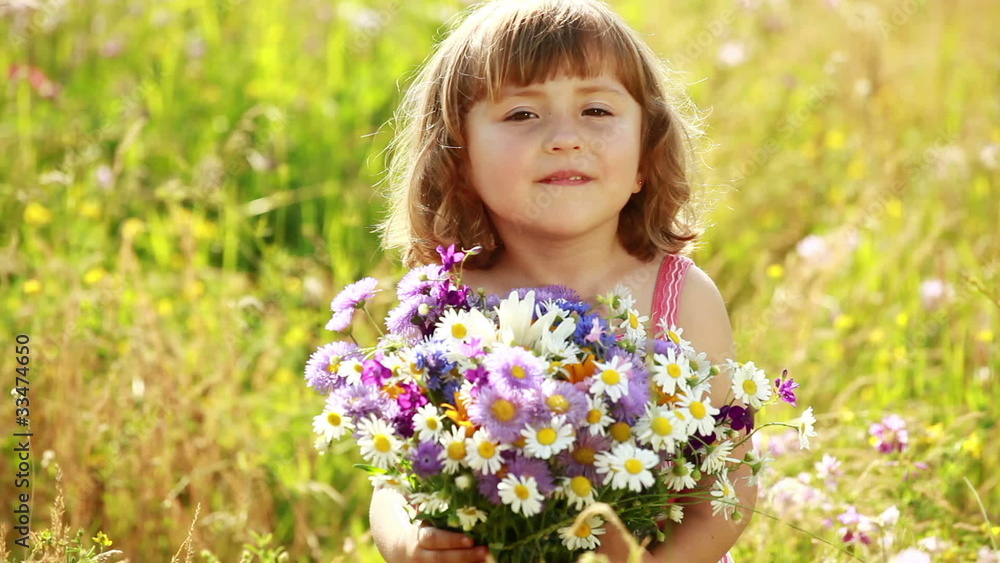 Girl with flowers turned to the camera Girl with flowers turned to the camera