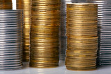 Golden and silver coin stacks