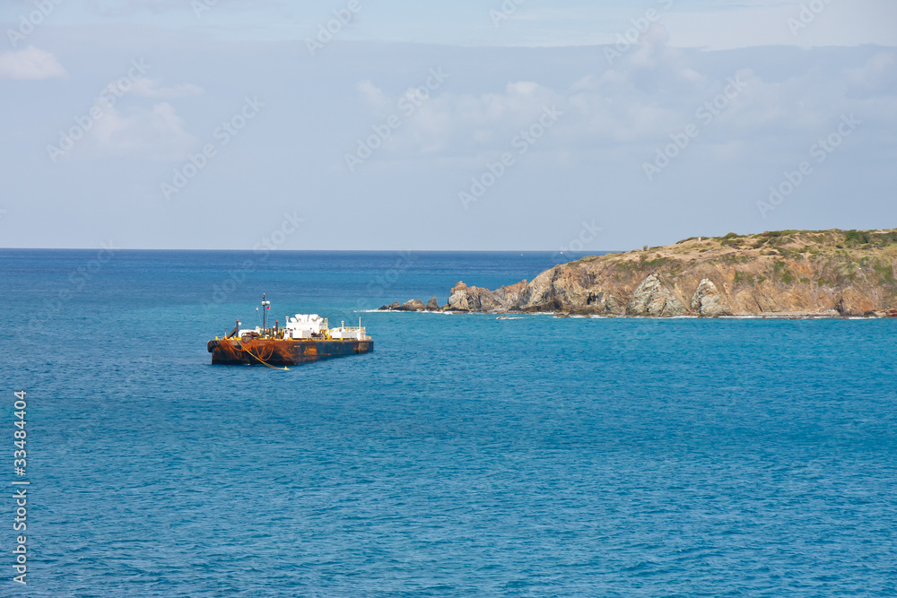 Old Rusty Tanker Anchored in Blue Water Old Rusty Tanker Anchored in Blue Water