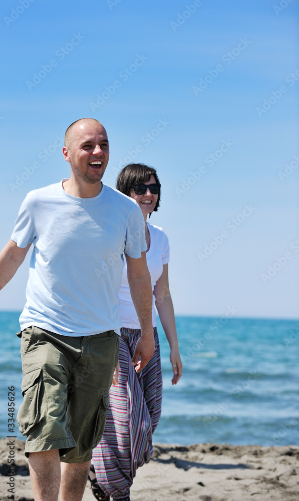 happy young couple have fun on beach happy young couple have fun on beach