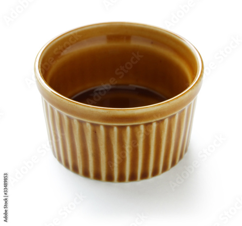 empty ramekin isolated on white background photo