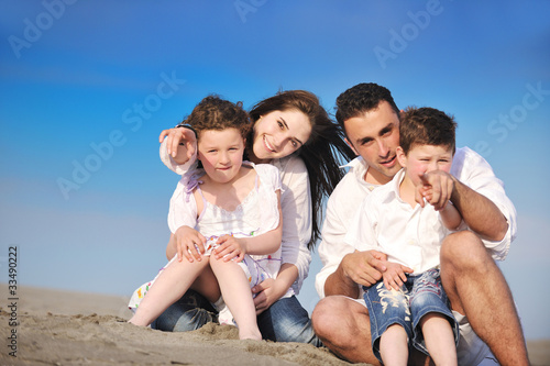 happy young family have fun on beach