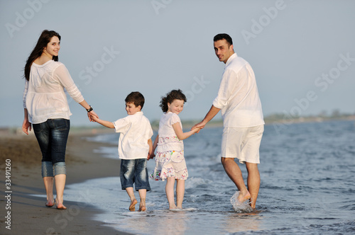 happy young family have fun on beach