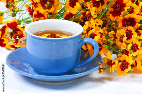 The blue cup of tea with nice flowers