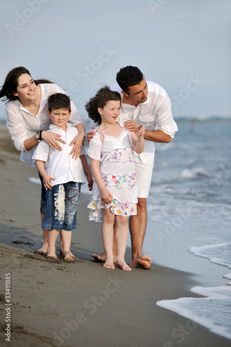 happy young family have fun on beach