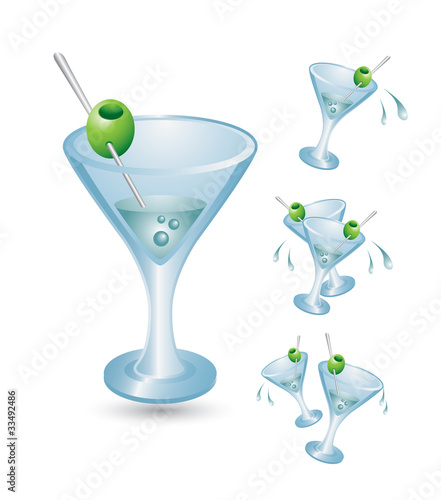 Martini glasses spilling on white background