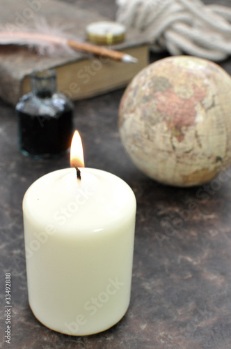 Vintage globe and candle