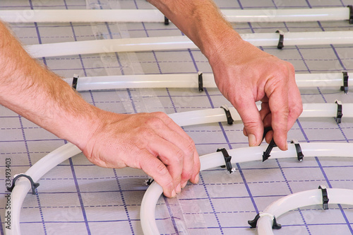 Cuadro en lienzo Fussbodenheizung verlegen - install under slab heating 01