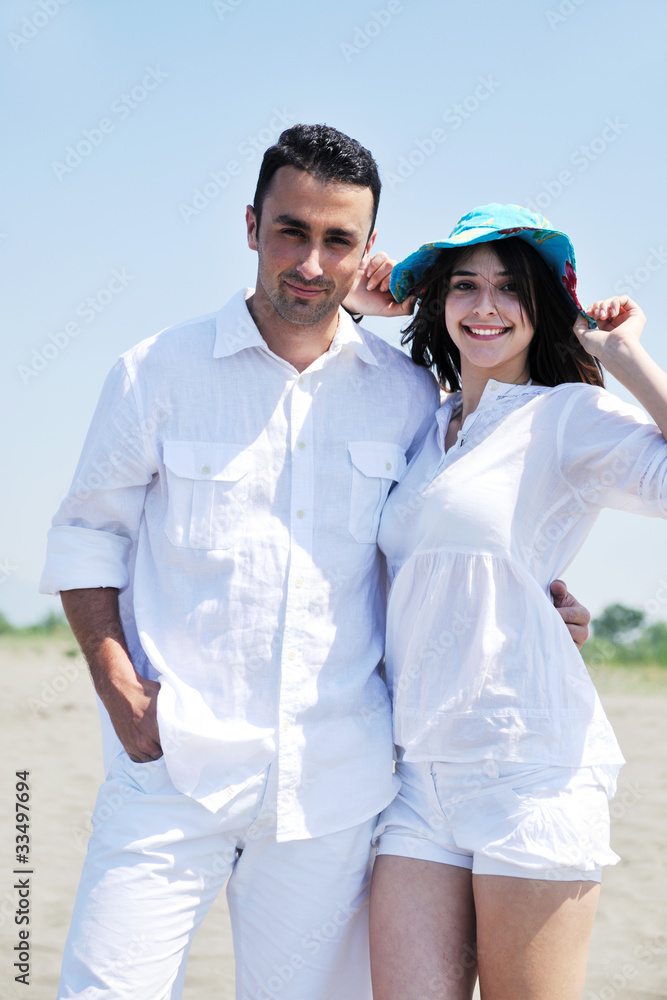 happy young couple have fun on beach happy young couple have fun on beach