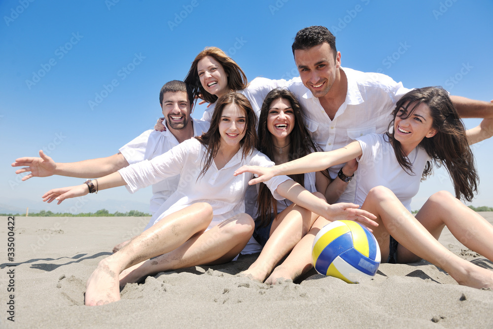 happy young people group have fun on beach happy young people group have fun on beach