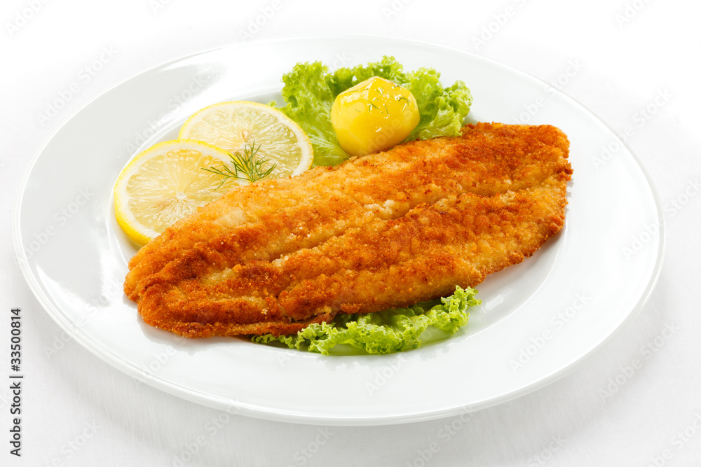 Fish dish - fried fish fillet with vegetables Fish dish - fried fish fillet with vegetables