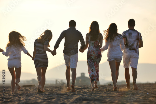 happy young people group have fun on beach