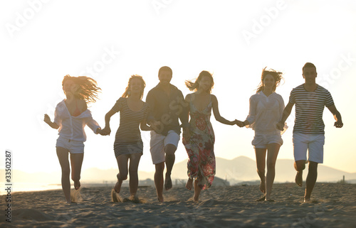 happy young people group have fun on beach