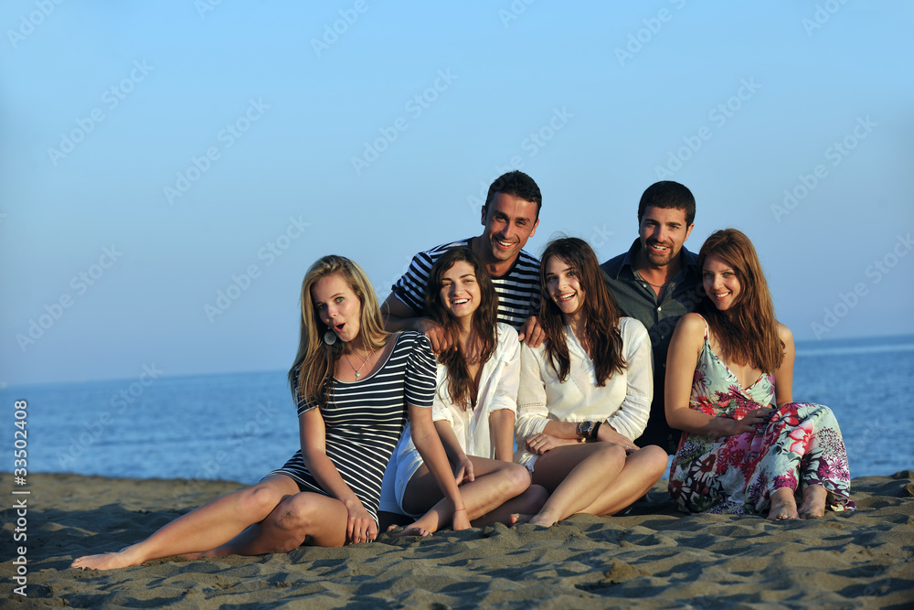 happy young people group have fun on beach happy young people group have fun on beach