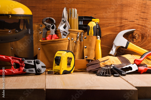 set of working tools on wooden boards