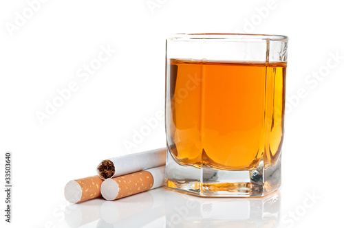 glass of cognac and cigarettes