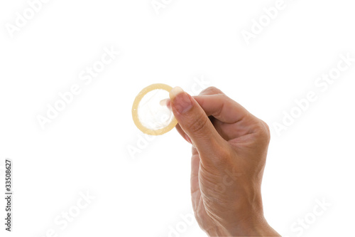 womans hand holding condom