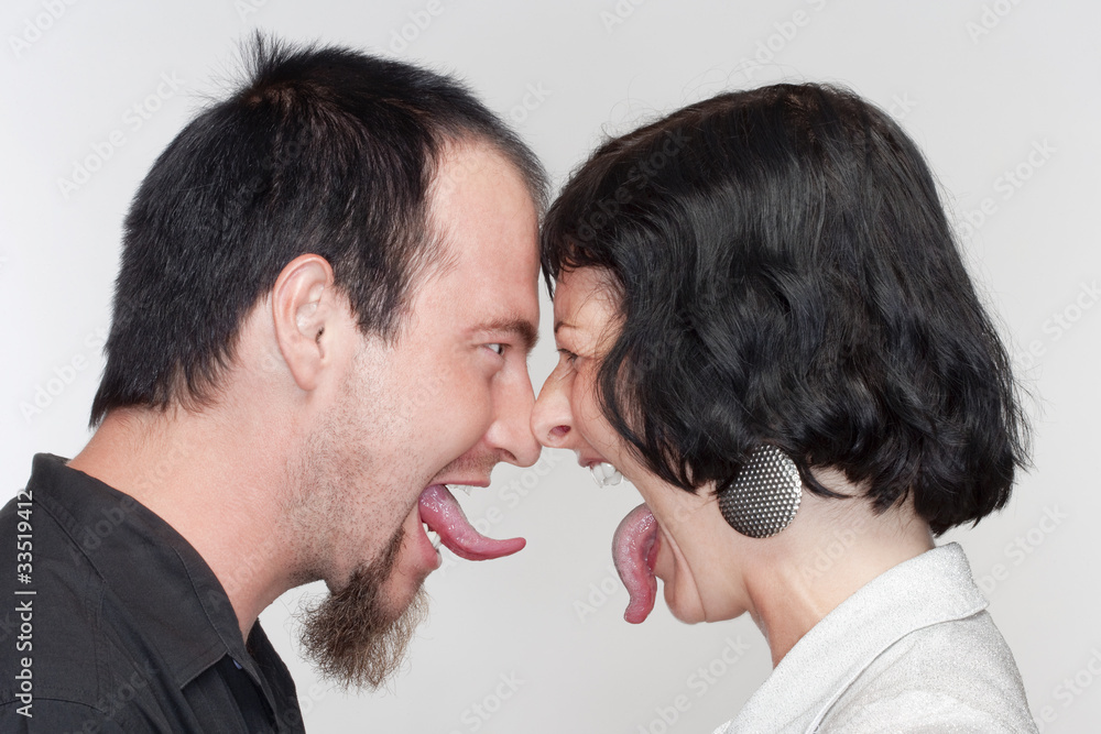 couple sticking out tongues couple sticking out tongues