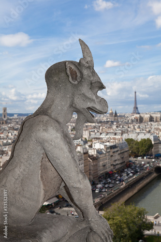Gargoyle Statue cathedral Notre Dame, top view on tower Eiffel © SergeyAK