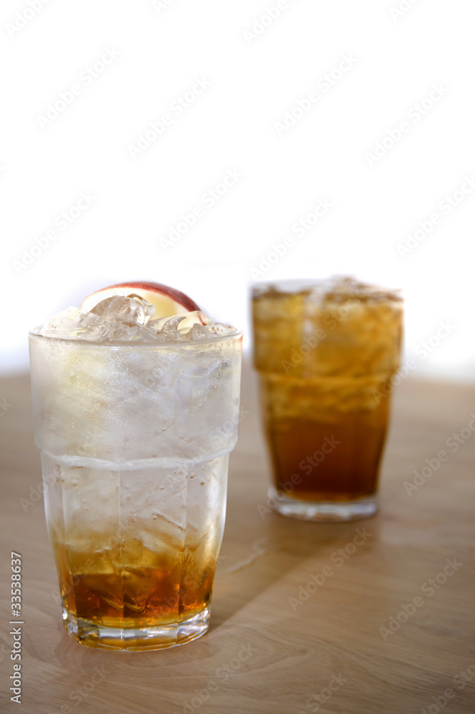 ice soda apple on wood and white backgrounds ice soda apple on wood and white backgrounds