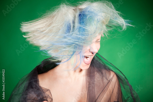 Screaming crazy girl with platinum hair photo