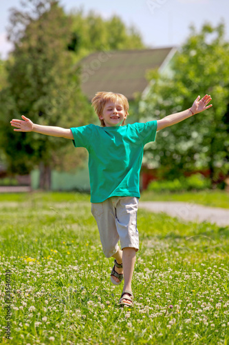 Little boy running in park